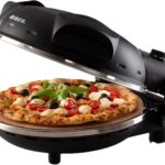 Ariete Pizzaofen 917, 4-Minuten-Pizza, Pizzaofen mit 5 Garstufen, Feuerfeste Platte zum Wiederaufwärmen, Holzbrettchen im Lieferumfang Enthalten, Max. Temperatur 400°C, 1200W, Schwarz